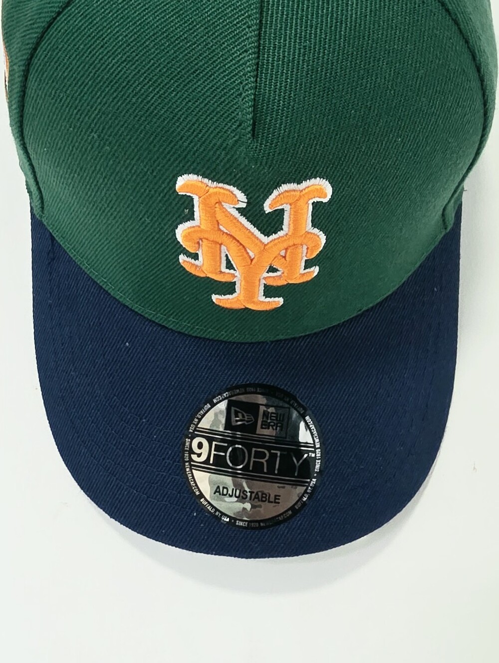 New Era 9FORTY Green & Navy MLB Hat with Orange Logo